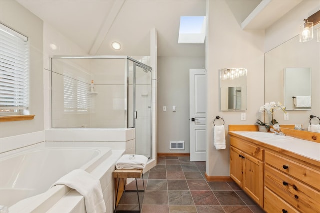 322 Wood Run Dr Unit B, Whitefish, MT 59937 - bathroom with a bath, a stall shower, vanity, baseboards, and stone finish flooring
