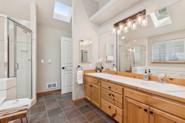 322 Wood Run Dr Unit B, Whitefish, MT 59937 - full bath with a skylight, a stall shower, and double vanity