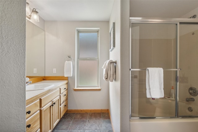 322 Wood Run Dr Unit B, Whitefish, MT 59937 - full bath featuring vanity, enclosed tub / shower combo, and baseboards