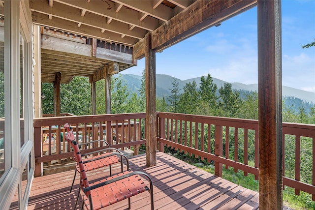 322 Wood Run Dr Unit B, Whitefish, MT 59937 - wooden terrace with a mountain view