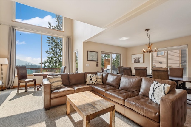 322 Wood Run Dr Unit B, Whitefish, MT 59937 - living area featuring a chandelier and carpet flooring
