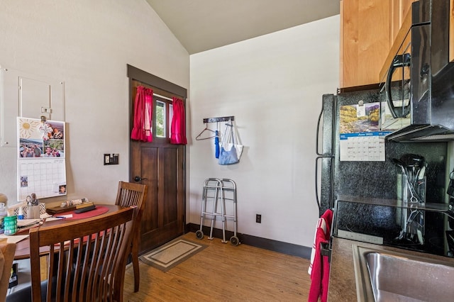 119 5th Ave W, Kalispell, MT 59901 - dining room with light wood-type flooring, lofted ceiling, an office area, and baseboards