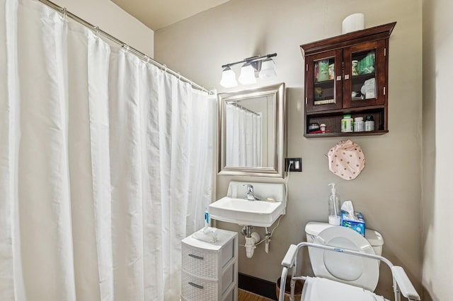 119 5th Ave W, Kalispell, MT 59901 - bathroom with toilet and a shower with shower curtain