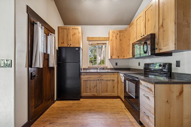 119 5th Ave W, Kalispell, MT 59901 - kitchen featuring black appliances, light brown cabinets, a sink, and vaulted ceiling