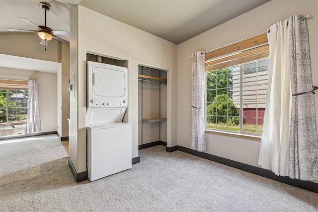 119 5th Ave W, Kalispell, MT 59901 - laundry area featuring stacked washer and clothes dryer, carpet, baseboards, and ceiling fan