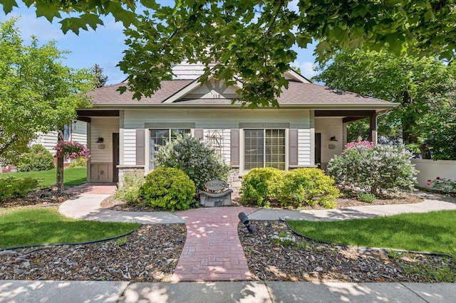 119 5th Ave W, Kalispell, MT 59901 - view of front facade with roof with shingles and a front yard