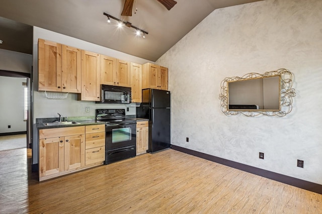 119 5th Ave W, Kalispell, MT 59901 - kitchen with black appliances, light brown cabinetry, baseboards, a sink, and light wood-style floors
