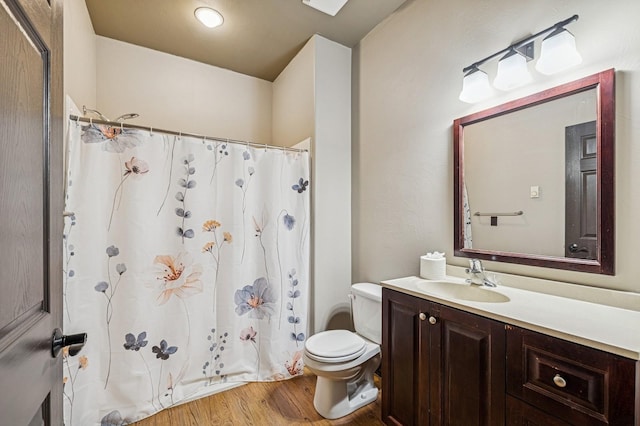 119 5th Ave W, Kalispell, MT 59901 - full bath with wood finished floors, toilet, and vanity