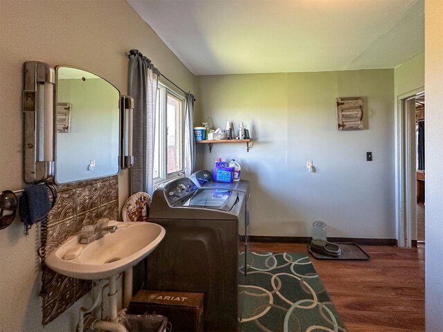 481 24th Rd NE, Dutton, MT 59433 - laundry area with washer and dryer, wood finished floors, and baseboards