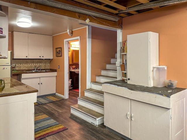 481 24th Rd NE, Dutton, MT 59433 - basement with dark wood-type flooring, freestanding refrigerator, stairway, and a sink