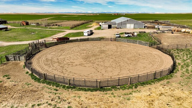 481 24th Rd NE, Dutton, MT 59433 - view of yard featuring a view of countryside, an enclosed riding area, and an outbuilding