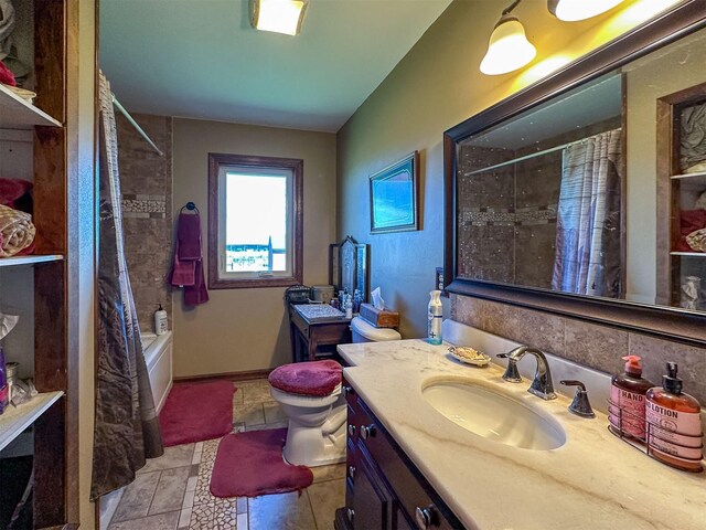 481 24th Rd NE, Dutton, MT 59433 - bathroom featuring vanity, shower / bath combo with shower curtain, and toilet