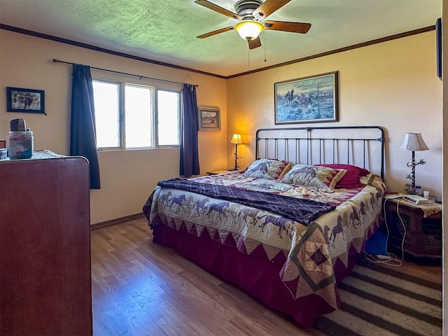481 24th Rd NE, Dutton, MT 59433 - bedroom with wood finished floors, a ceiling fan, ornamental molding, and baseboards