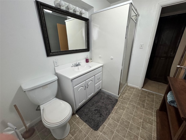1631 Juniper Dr, Havre, MT 59501 - full bathroom with vanity, baseboards, toilet, and a stall shower