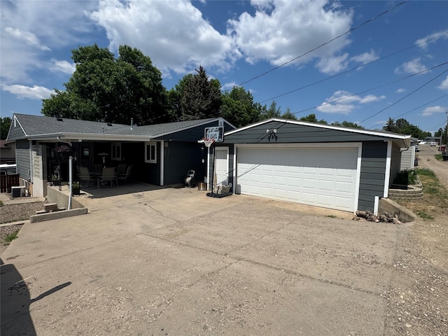1631 Juniper Dr, Havre, MT 59501 - view of front of home featuring an outdoor structure, driveway, and an attached garage