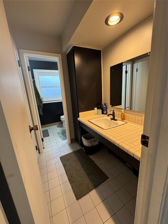 1631 Juniper Dr, Havre, MT 59501 - bathroom featuring toilet, tile patterned flooring, and vanity