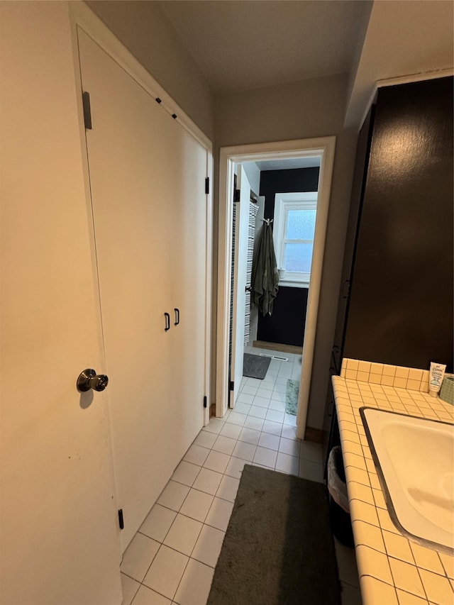1631 Juniper Dr, Havre, MT 59501 - bathroom featuring tile patterned floors and vanity