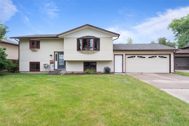 417 56th St S, Great Falls, MT 59405 - view of front of property featuring a garage, driveway, and a front lawn