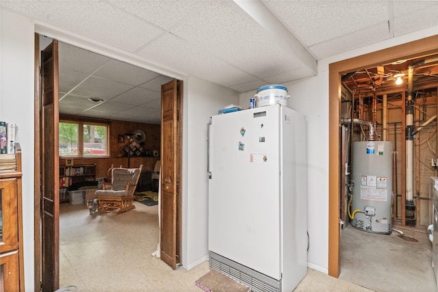 417 56th St S, Great Falls, MT 59405 - kitchen with freestanding refrigerator, water heater, a drop ceiling, and light flooring
