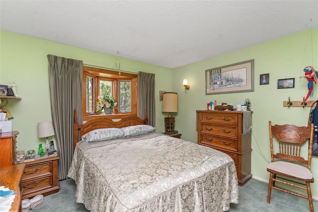 417 56th St S, Great Falls, MT 59405 - carpeted bedroom featuring a textured ceiling and baseboards