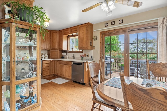 417 56th St S, Great Falls, MT 59405 - kitchen featuring dishwasher, light countertops, a ceiling fan, light wood-style floors, and a sink