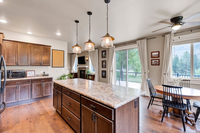 12800 Mill Creek Rd, Lolo, MT 59847 - kitchen featuring a ceiling fan, healthy amount of natural light, light wood-style floors, and recessed lighting