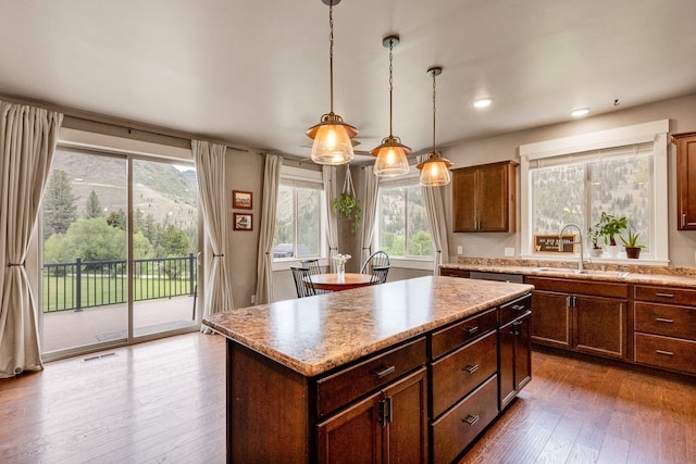 12800 Mill Creek Rd, Lolo, MT 59847 - kitchen with a sink, dark wood-style floors, a kitchen island, hanging light fixtures, and recessed lighting