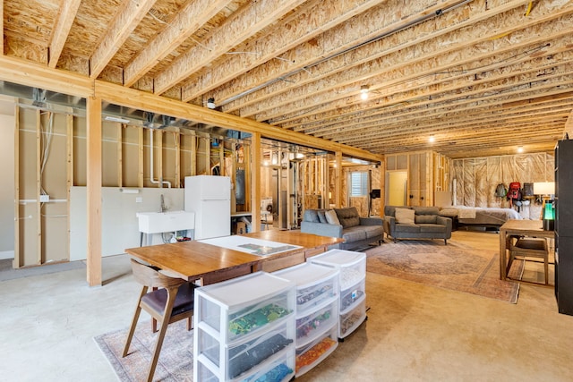 12800 Mill Creek Rd, Lolo, MT 59847 - unfinished below grade area with freestanding refrigerator and a sink