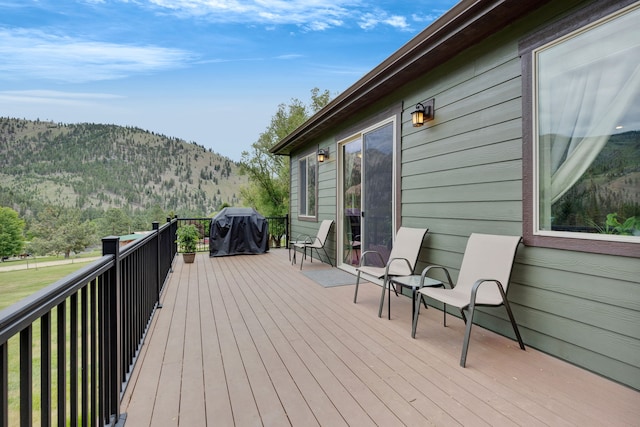 12800 Mill Creek Rd, Lolo, MT 59847 - wooden terrace with a mountain view and a grill