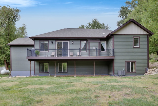 12800 Mill Creek Rd, Lolo, MT 59847 - rear view of house featuring cooling unit, a lawn, and a deck