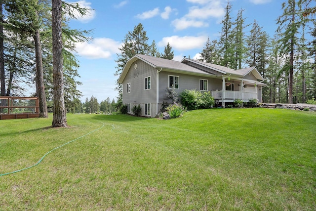 4357 Trumble Creek Rd, Columbia Falls, MT 59912 - view of side of home featuring a lawn