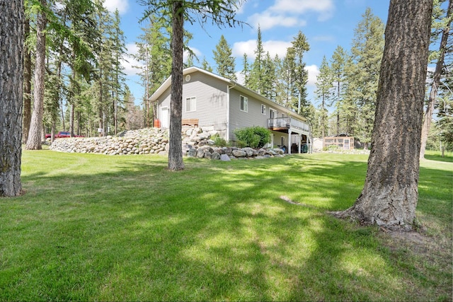 4357 Trumble Creek Rd, Columbia Falls, MT 59912 - view of grassy yard with a deck