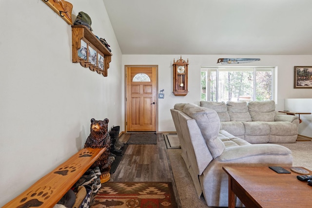 4357 Trumble Creek Rd, Columbia Falls, MT 59912 - living area featuring lofted ceiling, dark wood-style floors, and baseboards