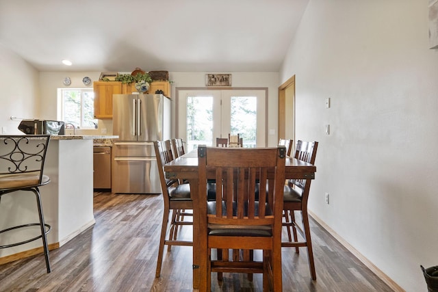 4357 Trumble Creek Rd, Columbia Falls, MT 59912 - dining space with dark wood-style floors, baseboards, and french doors