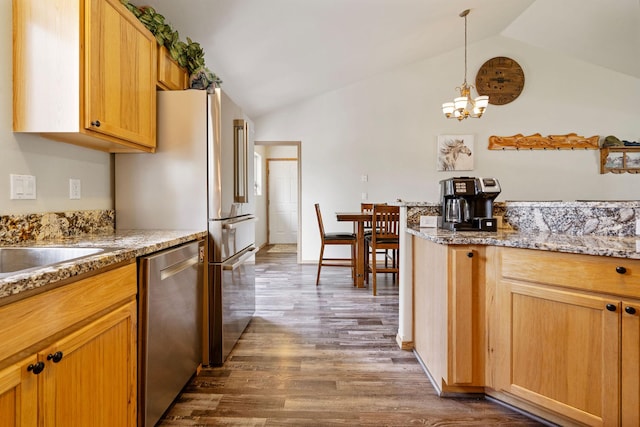 4357 Trumble Creek Rd, Columbia Falls, MT 59912 - kitchen with dishwasher, vaulted ceiling, dark wood finished floors, a chandelier, and decorative light fixtures