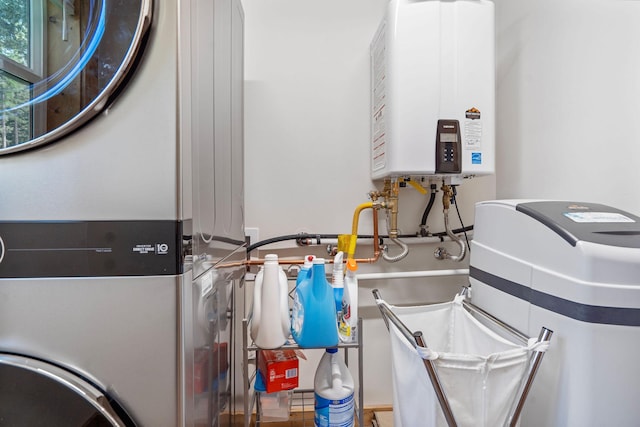 4357 Trumble Creek Rd, Columbia Falls, MT 59912 - utility room with tankless water heater and stacked washer and clothes dryer