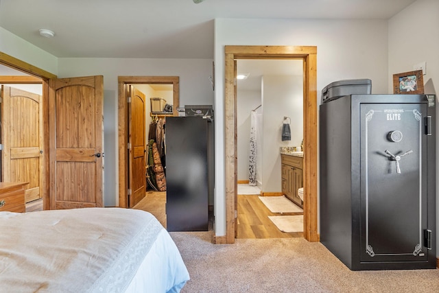 4357 Trumble Creek Rd, Columbia Falls, MT 59912 - bedroom featuring light colored carpet, a walk in closet, ensuite bath, and a closet