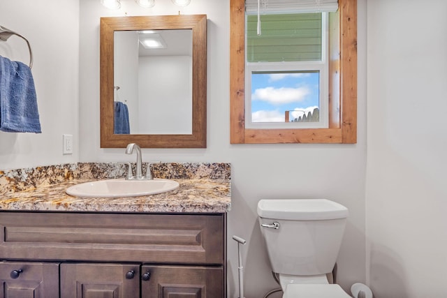 4357 Trumble Creek Rd, Columbia Falls, MT 59912 - bathroom featuring vanity and toilet