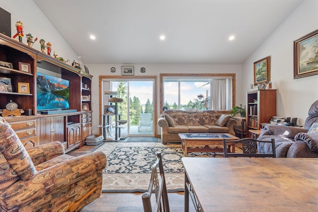 4357 Trumble Creek Rd, Columbia Falls, MT 59912 - living room featuring lofted ceiling, recessed lighting, and healthy amount of natural light
