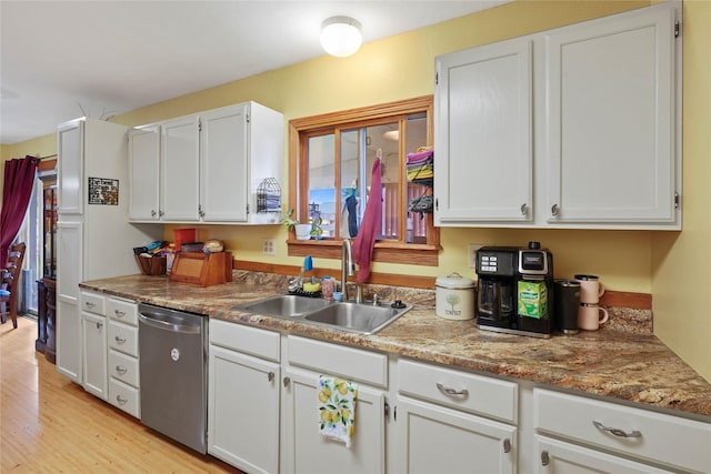 1021 Vallejo Rd, Helena, MT 59602 - kitchen featuring stainless steel dishwasher, a sink, white cabinets, and light wood finished floors