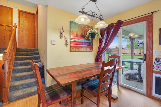 1021 Vallejo Rd, Helena, MT 59602 - dining area with light wood-type flooring and stairs