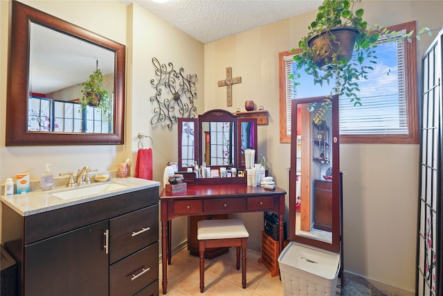 1021 Vallejo Rd, Helena, MT 59602 - bathroom with vanity, a textured ceiling, and tile patterned floors
