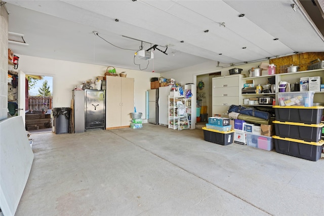 1021 Vallejo Rd, Helena, MT 59602 - garage with freestanding refrigerator and a garage door opener