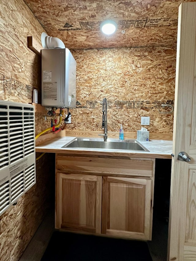 22 Indian Creek Rd, Townsend, MT 59644 - kitchen with water heater, a sink, and light countertops