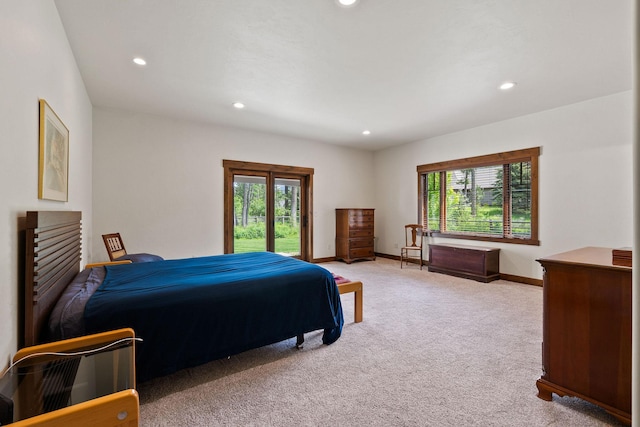74 Wood Ridge Dr, Columbia Falls, MT 59912 - bedroom featuring recessed lighting, light colored carpet, access to outside, and baseboards