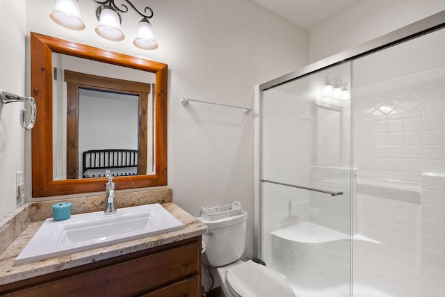 74 Wood Ridge Dr, Columbia Falls, MT 59912 - bathroom featuring vanity, a shower stall, and toilet