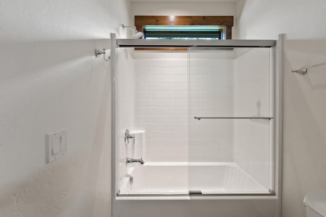 74 Wood Ridge Dr, Columbia Falls, MT 59912 - full bathroom featuring bath / shower combo with glass door and toilet