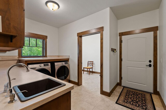 74 Wood Ridge Dr, Columbia Falls, MT 59912 - washroom with independent washer and dryer, baseboards, and light tile patterned flooring