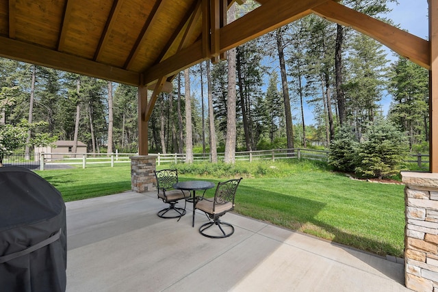 74 Wood Ridge Dr, Columbia Falls, MT 59912 - view of patio with grilling area and view of scattered trees