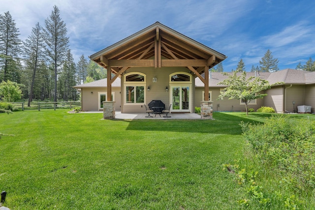 74 Wood Ridge Dr, Columbia Falls, MT 59912 - back of property featuring a patio area